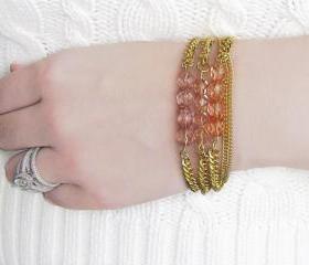 Bead Bracelet Stack in Transparent Shades of Pink on Gold Chain
